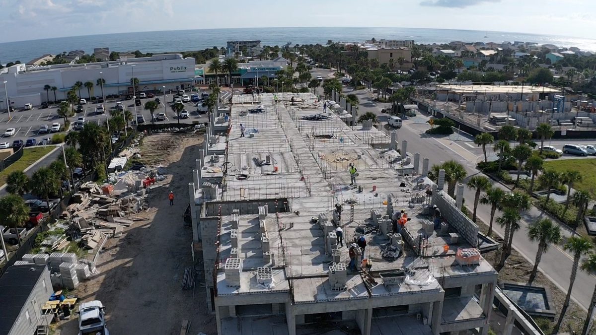 Aerial shot of Holiday Inn under construction with ocean in background