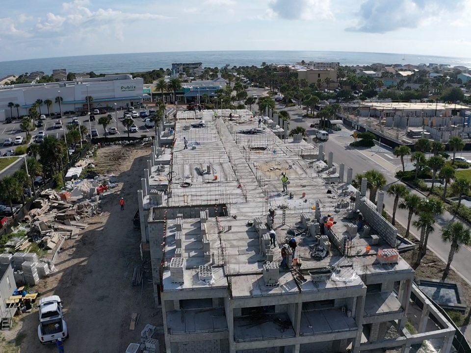 Aerial shot of Holiday Inn under construction with ocean in background